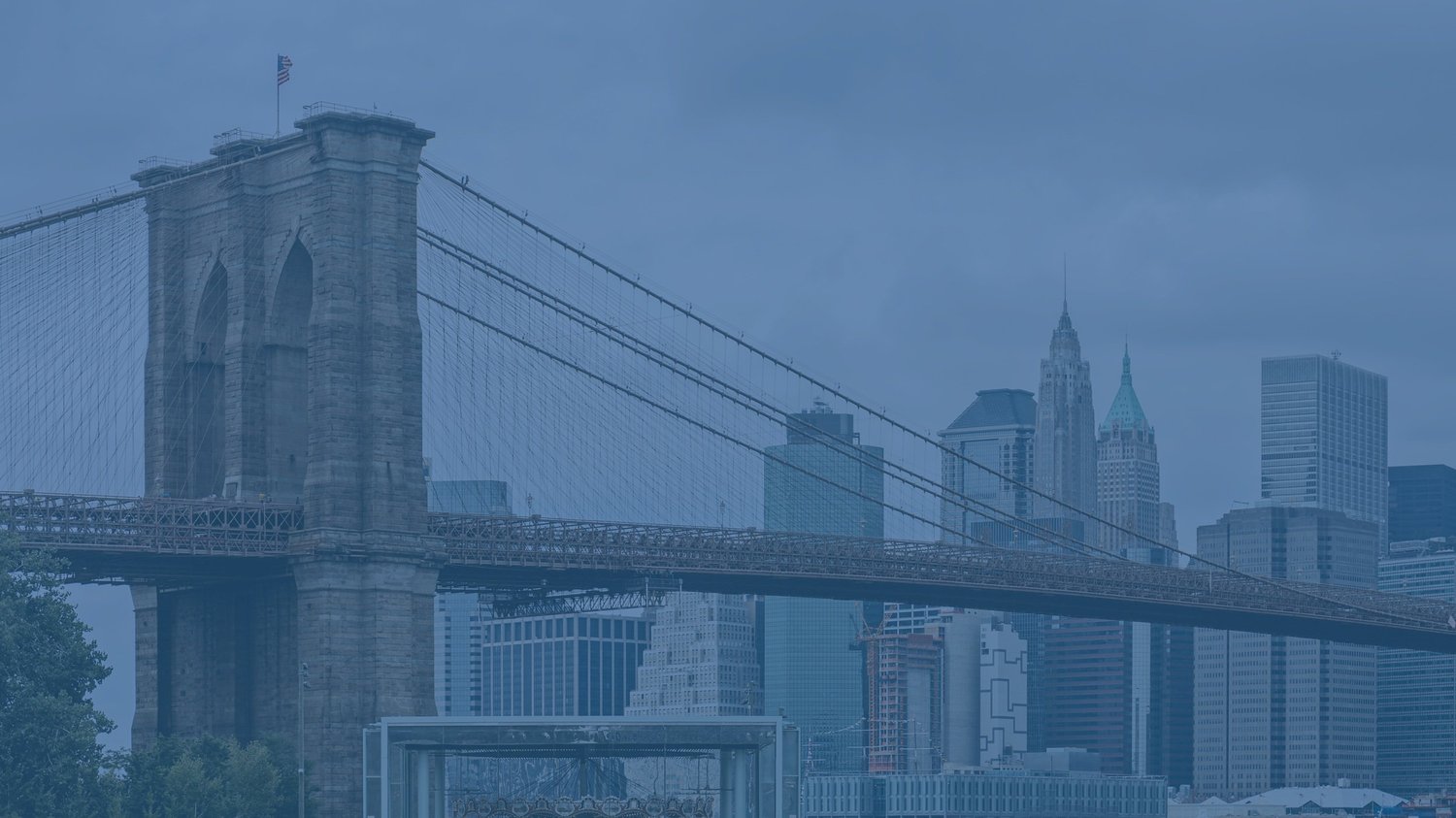 Brooklyn Bridge spanning the East River with the Manhattan skyline beyond